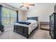 Cozy bedroom featuring neutral colored walls, and a black furniture set at 9839 Lemon Drop Loop, Sun City Center, FL 33573