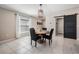 Dining room featuring a round wooden table, chairs, and a sliding barn door at 9839 Lemon Drop Loop, Sun City Center, FL 33573