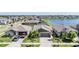 Charming single-Gathering home with a well-manicured lawn and a two-car garage in a lakeside community at 9839 Lemon Drop Loop, Sun City Center, FL 33573