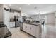Kitchen with granite countertops, stainless steel appliances, and a view into dining and living space at 9839 Lemon Drop Loop, Sun City Center, FL 33573