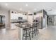 Kitchen with granite countertops, stainless steel appliances, and island with seating at 9839 Lemon Drop Loop, Sun City Center, FL 33573