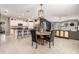 Open floor plan with kitchen island, dining area, and living room at 9839 Lemon Drop Loop, Sun City Center, FL 33573