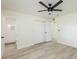 This bedroom features light, neutral walls, light wood-look floors and two closets at 1008 Shangri La Dr, Seffner, FL 33584