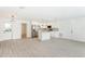 Spacious open-concept design featuring hardwood floors, connecting living and a modern, bright kitchen at 1008 Shangri La Dr, Seffner, FL 33584