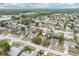 Aerial view of homes in a suburban neighborhood at 10304 Rainbow Oaks Dr, Hudson, FL 34667