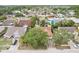 Aerial view of a residential neighborhood showcasing well-maintained homes and mature trees at 10304 Rainbow Oaks Dr, Hudson, FL 34667