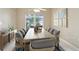 Virtual staging of a dining room with lots of seating and a window with a view at 10304 Rainbow Oaks Dr, Hudson, FL 34667