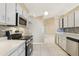 Kitchen with white cabinets, stainless appliances, and sleek countertops at 10304 Rainbow Oaks Dr, Hudson, FL 34667