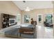 Spacious living room featuring tile floors, a fan, and a decorative stone wall at 10304 Rainbow Oaks Dr, Hudson, FL 34667