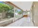 Enclosed patio with plenty of light and a hot tub at 10304 Rainbow Oaks Dr, Hudson, FL 34667