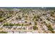 This high-angle aerial shot shows the layout of the neighborhood and proximity to surrounding amenities at 1051 Pert Ln, Holiday, FL 34691