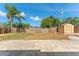 This backyard features a storage shed and mature trees for outdoor enjoyment at 1051 Pert Ln, Holiday, FL 34691