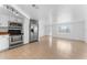 An eat-in kitchen features stainless steel appliances, tile floors, and bright light at 1051 Pert Ln, Holiday, FL 34691