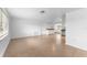 Spacious living room with tile flooring, light walls, and plenty of natural light at 1051 Pert Ln, Holiday, FL 34691
