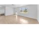 This bright living room features tile floors, white walls, and lots of natural light at 1051 Pert Ln, Holiday, FL 34691