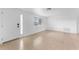 Bright living room featuring tile floors, white walls, and a front door at 1051 Pert Ln, Holiday, FL 34691