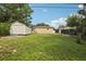 Spacious backyard with storage shed, offering plenty of space for outdoor activities at 109 Emerald Ln, Largo, FL 33771