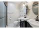 Functional bathroom with double sinks, vanity, and enclosed glass shower stall at 109 Emerald Ln, Largo, FL 33771