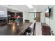 Open dining area featuring tile floors, sliding barn doors, and easy access to kitchen at 109 Emerald Ln, Largo, FL 33771