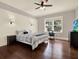 Comfortable bedroom with natural light, and a dark wood floor at 111 E Jean St, Tampa, FL 33604
