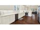 Beautiful white kitchen with ample cabinet space and stainless steel appliances at 111 E Jean St, Tampa, FL 33604