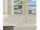 Farmhouse sink features in this white tiled kitchen at 111 E Jean St, Tampa, FL 33604