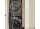 Convenient laundry closet features a stacked washer and dryer unit for space-saving efficiency at 111 E Jean St, Tampa, FL 33604