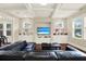 Bright living room with coffered ceilings, built-in shelving, and dark wood floors at 111 E Jean St, Tampa, FL 33604