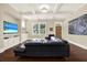 Comfortable living room showcasing hardwood floors, coffered ceilings, and stylish decor at 111 E Jean St, Tampa, FL 33604