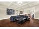 Inviting living room featuring hardwood floors, coffered ceilings, and a comfortable seating area at 111 E Jean St, Tampa, FL 33604