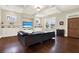Elegant living room with hardwood floors, coffered ceilings, and custom built-in shelving at 111 E Jean St, Tampa, FL 33604