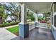 Inviting porch with a classic white porch swing, perfect for relaxing outdoors at 111 E Jean St, Tampa, FL 33604