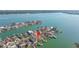 This is an aerial view of the home's location along a waterfront community, marked with a red pin at 11160 8Th E St, Treasure Island, FL 33706