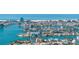 Breathtaking aerial panorama of a waterfront community surrounded by azure waters, showcasing a coastal lifestyle at 11160 8Th E St, Treasure Island, FL 33706