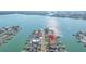 An aerial view showcases a waterfront neighborhood with canal access and the property marked with a pin at 11160 8Th E St, Treasure Island, FL 33706