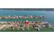 The aerial view highlights the property's location within a waterfront community, marked with a location pin at 11160 8Th E St, Treasure Island, FL 33706