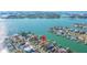 An aerial view of a waterfront neighborhood with the subject property marked by a red location pin at 11160 8Th E St, Treasure Island, FL 33706