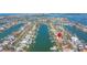 An aerial view reveals the waterfront community location of this home, marked by a red location pin at 11160 8Th E St, Treasure Island, FL 33706