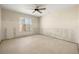 Bright bedroom featuring a ceiling fan and a large window at 11160 8Th E St, Treasure Island, FL 33706