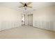 Bedroom with ceiling fan, walk-in closet, and doorway at 11160 8Th E St, Treasure Island, FL 33706