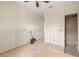 A bedroom featuring a ceiling fan and access to a bathroom at 11160 8Th E St, Treasure Island, FL 33706