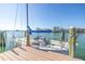 Sailboat docked at the end of a private pier, providing easy access to waterways at 11160 8Th E St, Treasure Island, FL 33706