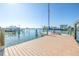 Spacious boat dock with a boat, providing direct access to the open bay for boating and water activities at 11160 8Th E St, Treasure Island, FL 33706