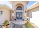 Stunning home entrance with arched doorway, double blue doors, and decorative stone accents, creating curb appeal at 11160 8Th E St, Treasure Island, FL 33706