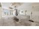 Open-concept living room with fireplace, multiple french doors and water views at 11160 8Th E St, Treasure Island, FL 33706