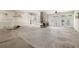 Spacious living area with a stone fireplace and French doors, offering potential for customization and ample natural light at 11160 8Th E St, Treasure Island, FL 33706