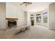 Spacious living room featuring a fireplace and large bay window with water view at 11160 8Th E St, Treasure Island, FL 33706