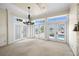 Bright living room with water views, showcasing French doors leading to the pool area and ample natural light at 11160 8Th E St, Treasure Island, FL 33706