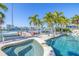 Inviting backyard with a pool, spa, palm trees, and access to a private dock and the bay at 11160 8Th E St, Treasure Island, FL 33706