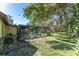 Backyard featuring a screened-in pool, mature trees, and a fenced-in area, ideal for outdoor living at 11307 Sandpine Rd, Riverview, FL 33569
